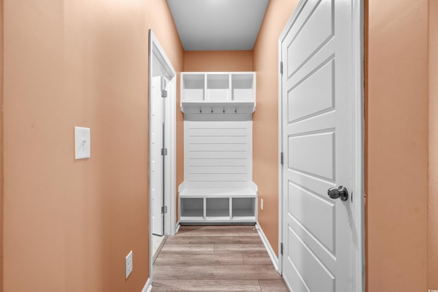 mudroom with light hardwood / wood-style floors