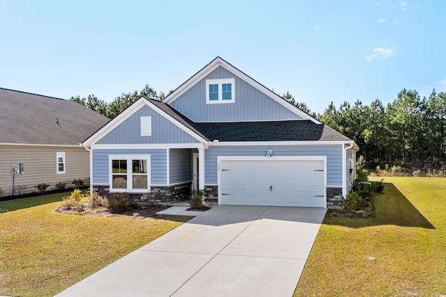 craftsman-style home with a front yard and a garage