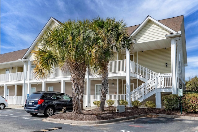 view of property with uncovered parking