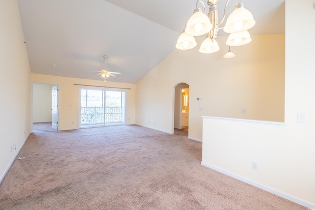 unfurnished room featuring baseboards, arched walkways, carpet flooring, high vaulted ceiling, and ceiling fan with notable chandelier