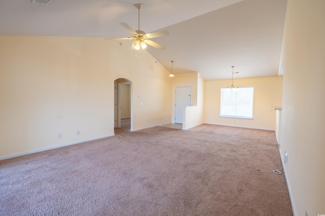 carpeted spare room with arched walkways, ceiling fan, high vaulted ceiling, visible vents, and baseboards