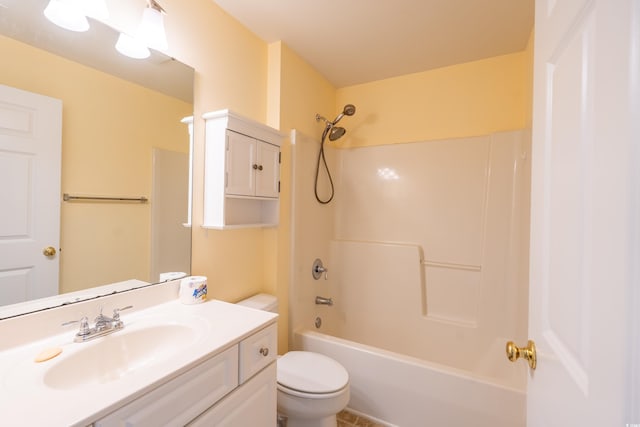 bathroom featuring tub / shower combination, vanity, and toilet