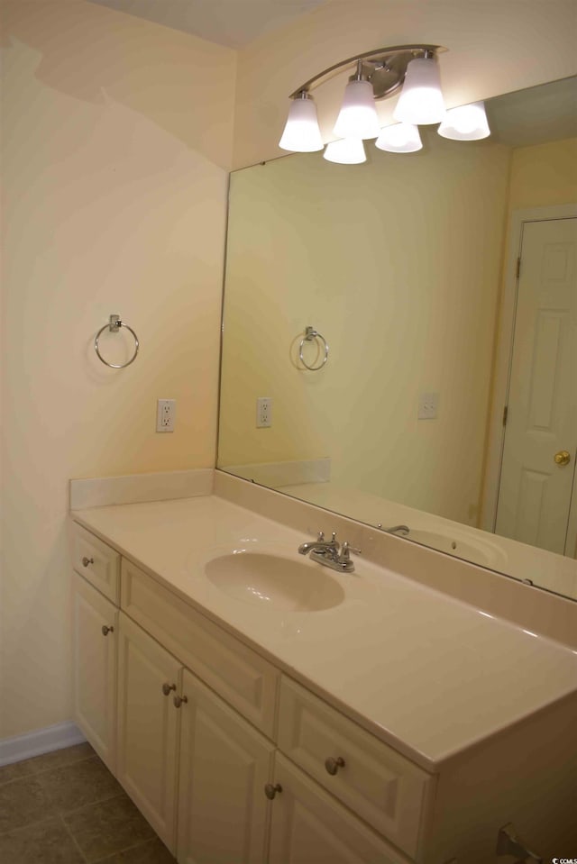 bathroom with tile patterned flooring and vanity