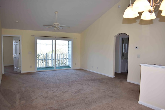 unfurnished living room with carpet flooring, lofted ceiling, and ceiling fan with notable chandelier