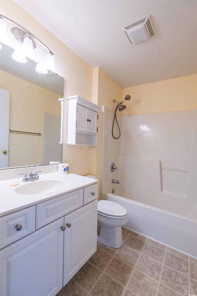 bathroom with visible vents, toilet, tile patterned flooring, bathtub / shower combination, and vanity