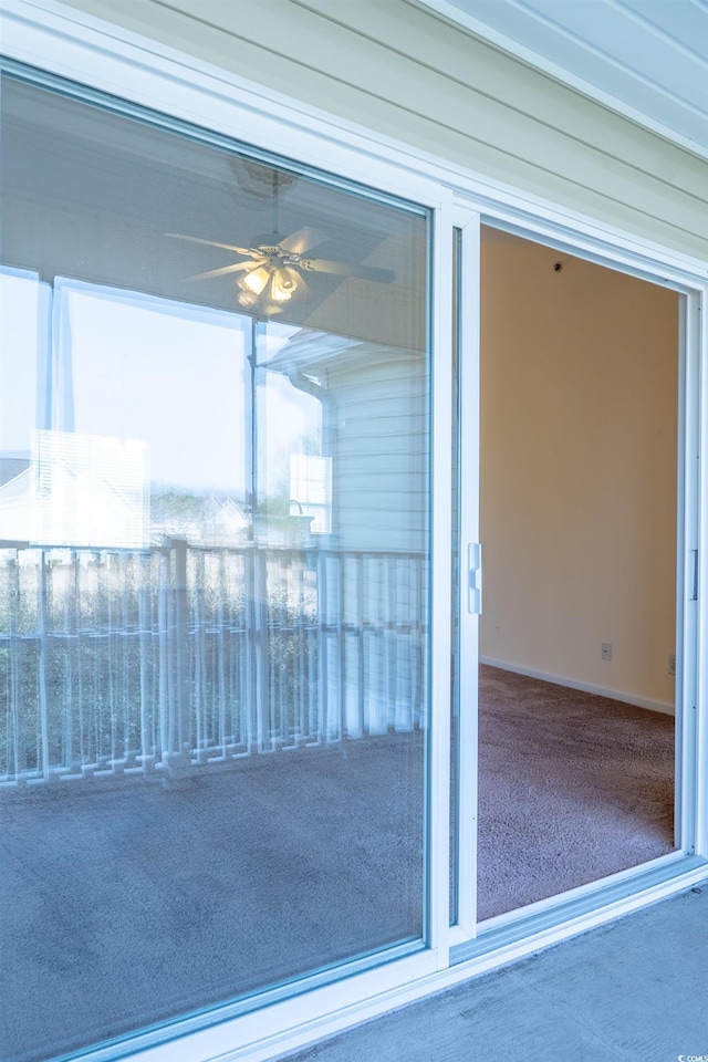 exterior space featuring ceiling fan