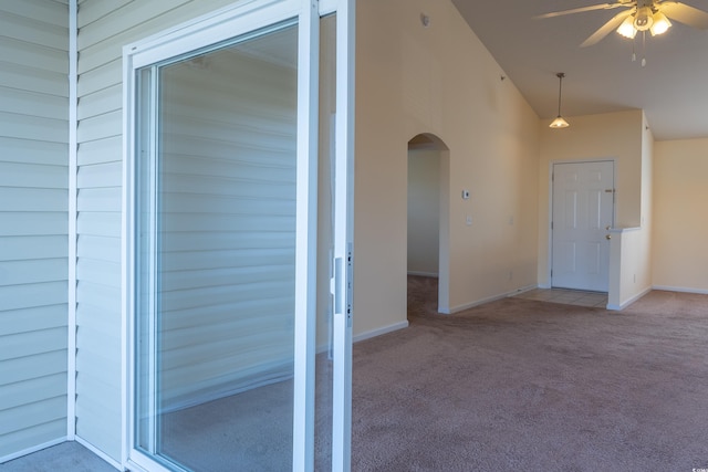 interior space with ceiling fan