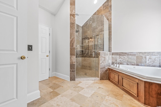 bathroom featuring lofted ceiling and shower with separate bathtub