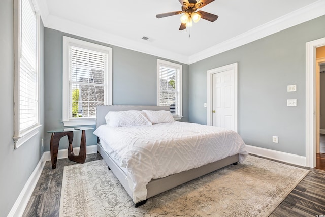 bedroom with ornamental molding, hardwood / wood-style flooring, and ceiling fan