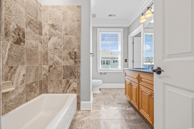 bathroom featuring vanity, toilet, crown molding, and a bathtub