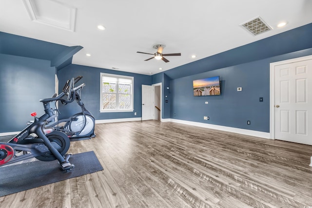 workout area featuring hardwood / wood-style flooring and ceiling fan