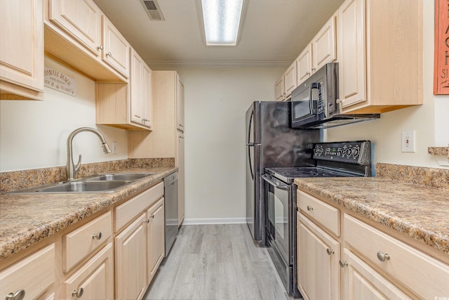 kitchen featuring sink, light brown cabinets, light hardwood / wood-style flooring, crown molding, and black appliances