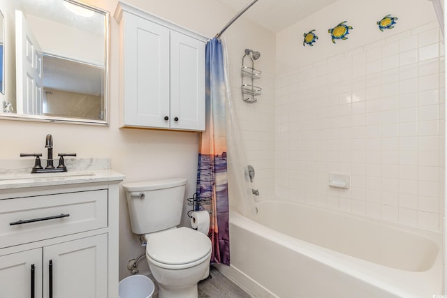 full bathroom featuring shower / tub combo with curtain, vanity, a textured ceiling, and toilet