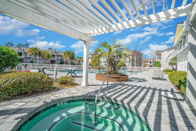 view of pool featuring a community hot tub and a pergola