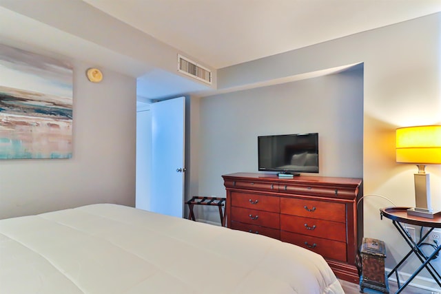 bedroom with hardwood / wood-style floors