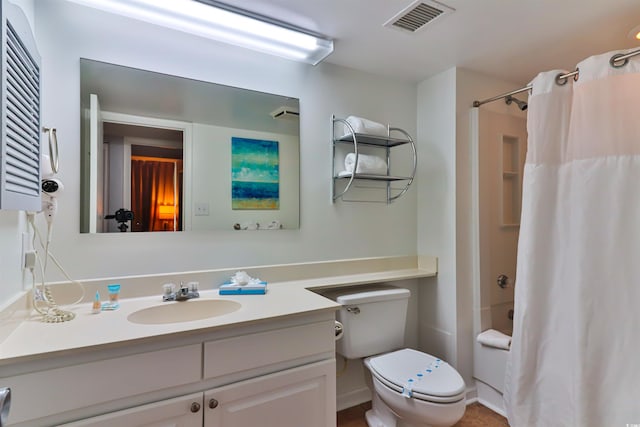 full bathroom featuring toilet, vanity, and shower / bathtub combination with curtain