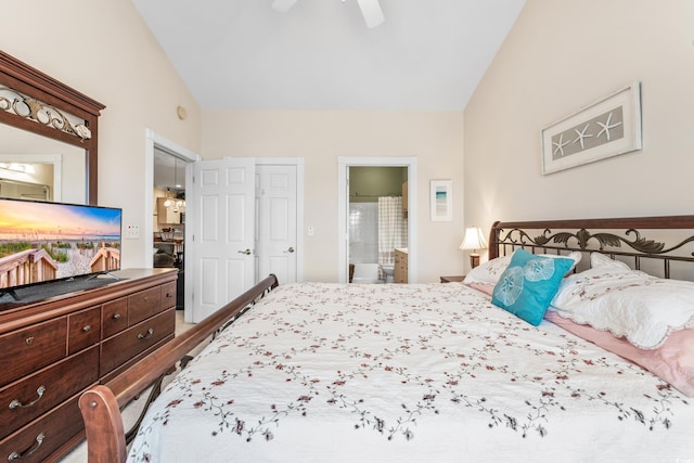 bedroom featuring lofted ceiling, ensuite bath, wood-type flooring, and ceiling fan