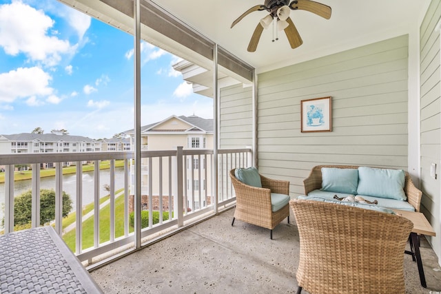 sunroom featuring ceiling fan and a healthy amount of sunlight