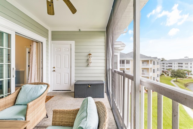 sunroom / solarium featuring ceiling fan