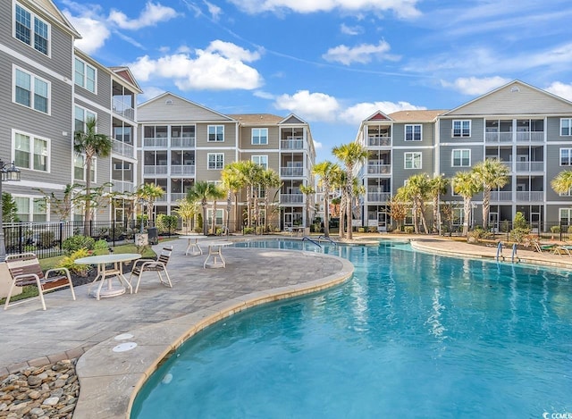 view of swimming pool featuring a patio area