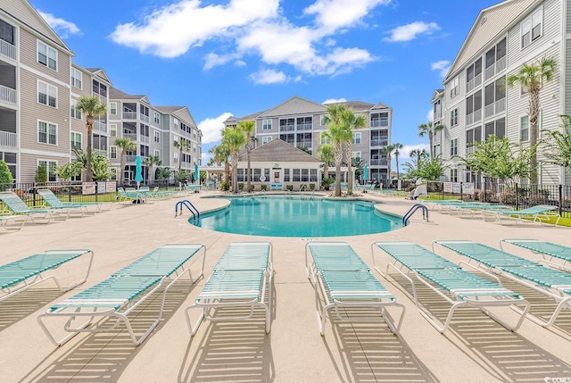 view of swimming pool with a patio area