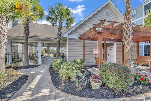 doorway to property with a pergola