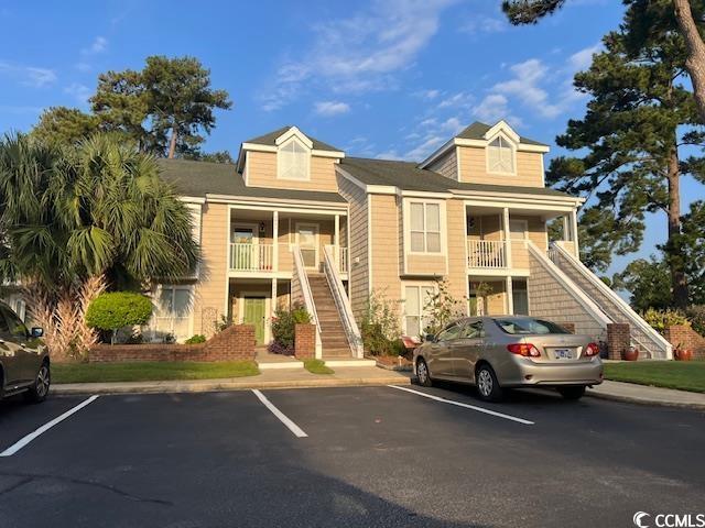 3831 Masters Ct Unit 137, Myrtle Beach, SC 29577 - view of property featuring stairway and uncovered parking