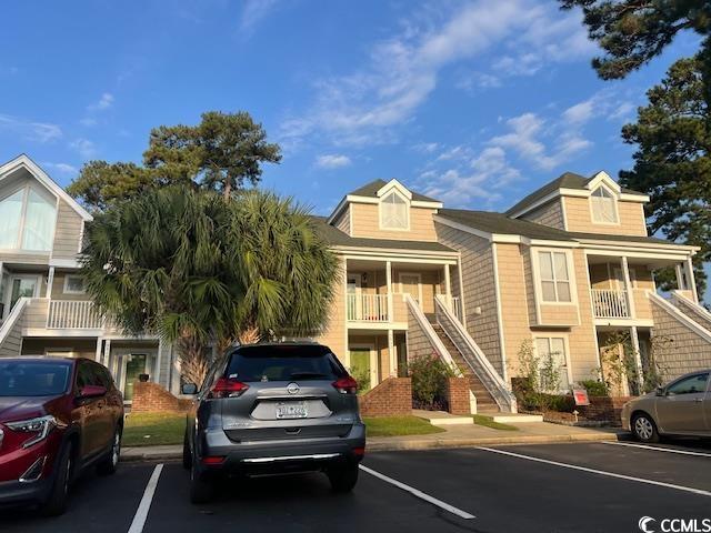 3831 Masters Ct Unit 137, Myrtle Beach, SC 29577 - view of property with stairs and uncovered parking