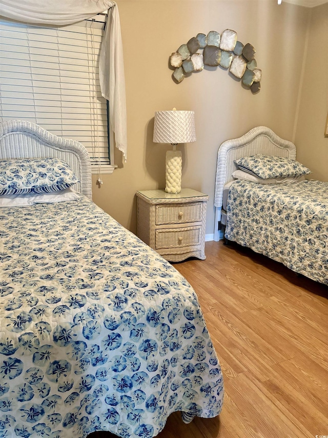 bedroom featuring wood finished floors