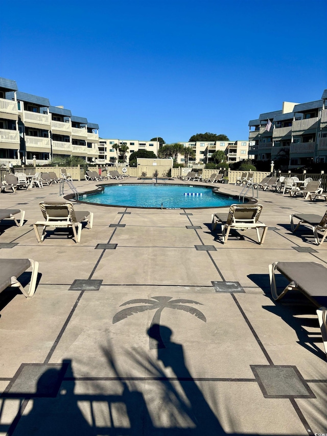 pool with a patio area