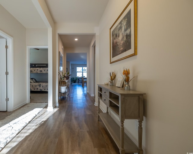 hallway with dark wood-type flooring