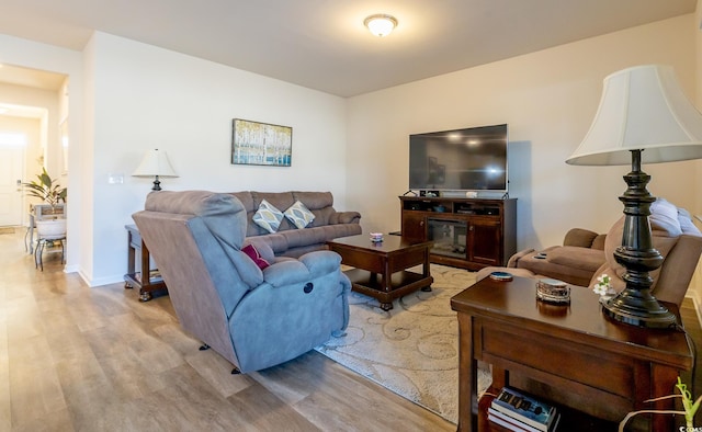 living room with light hardwood / wood-style flooring