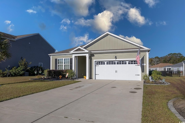 view of front facade with a front lawn and a garage