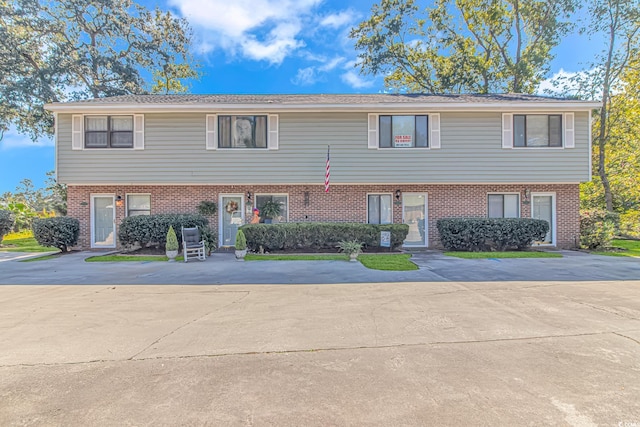 multi unit property featuring brick siding