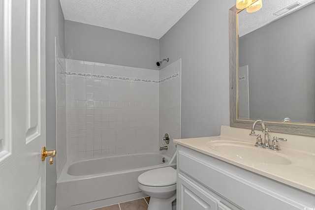 bathroom featuring visible vents, toilet, a textured ceiling, tile patterned flooring, and vanity