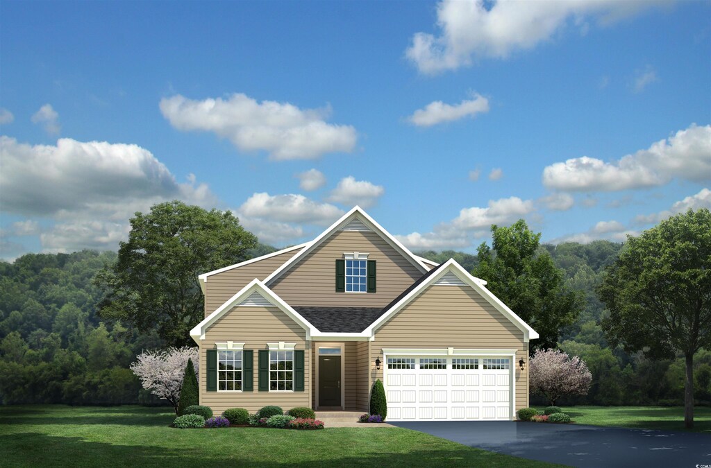 view of front facade with a front yard and a garage