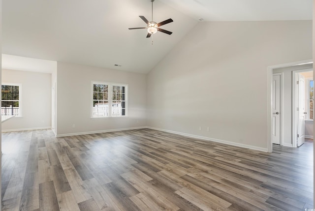 unfurnished living room with ceiling fan, a healthy amount of sunlight, and hardwood / wood-style flooring