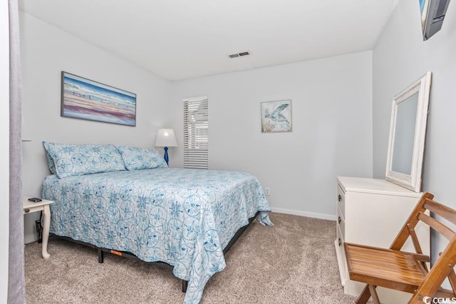 carpeted bedroom with visible vents and baseboards