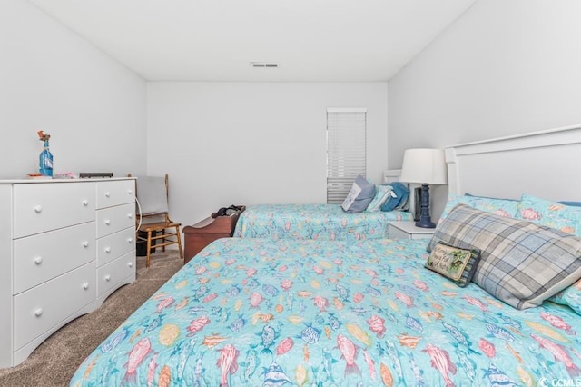 bedroom featuring carpet flooring and visible vents
