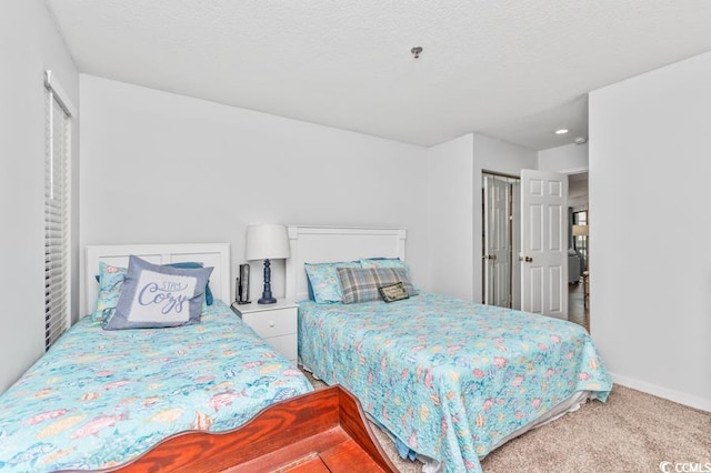 carpeted bedroom with baseboards