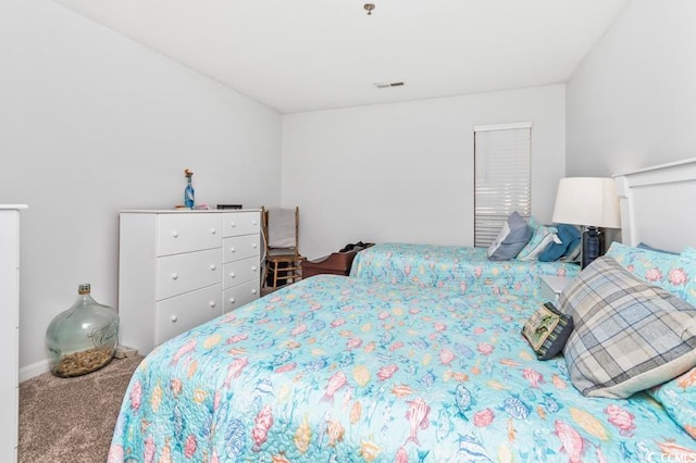 carpeted bedroom with visible vents