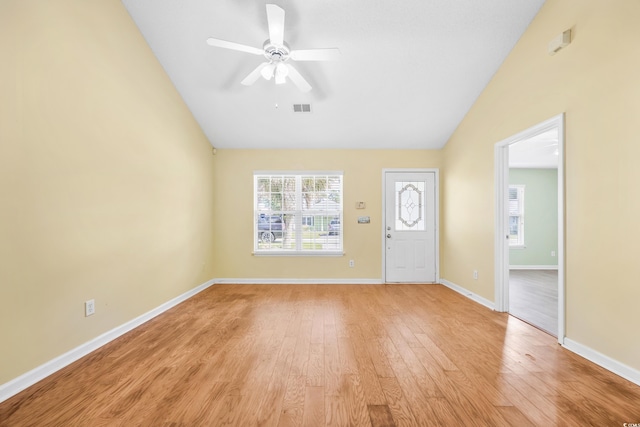 entryway featuring vaulted ceiling, light wood-type flooring, and ceiling fan