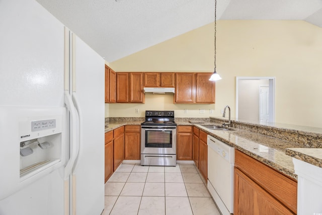 kitchen with white appliances, light stone countertops, sink, hanging light fixtures, and high vaulted ceiling