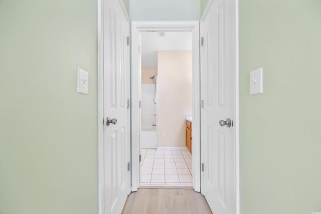 hallway with light wood-type flooring