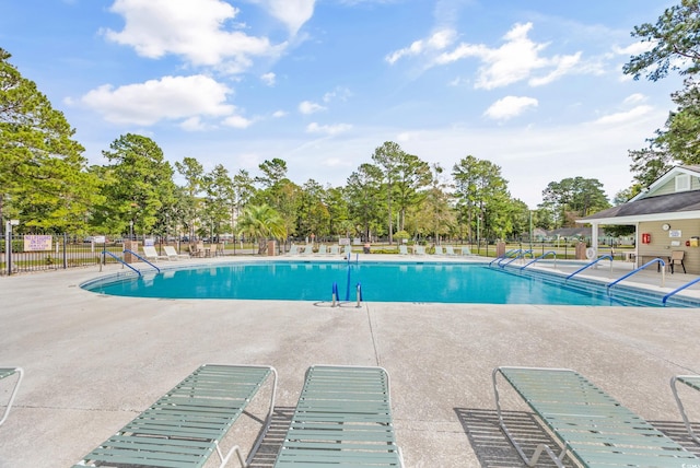 view of swimming pool with a patio