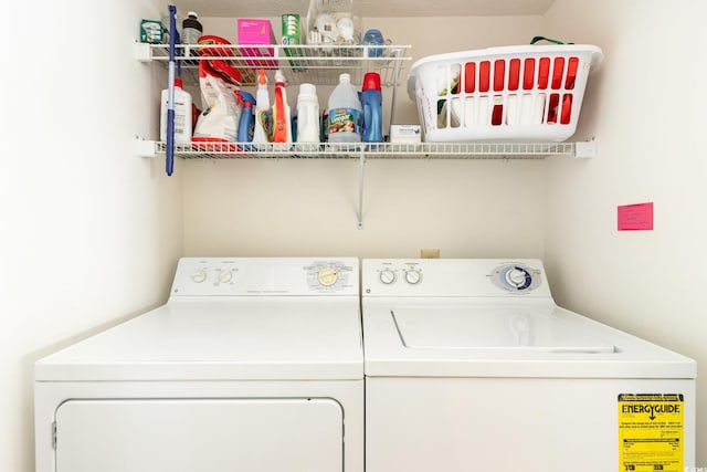 washroom featuring washing machine and dryer