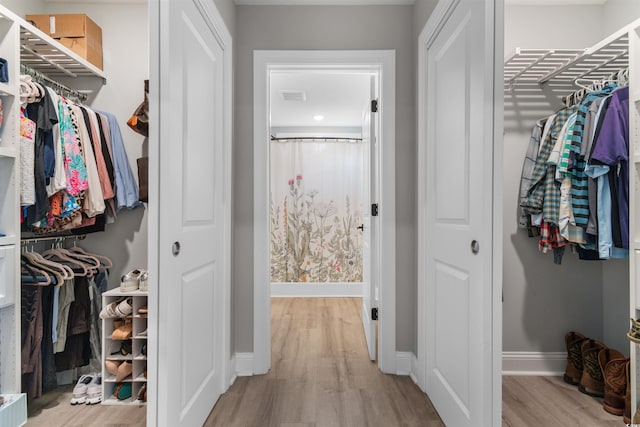 spacious closet with light wood-type flooring