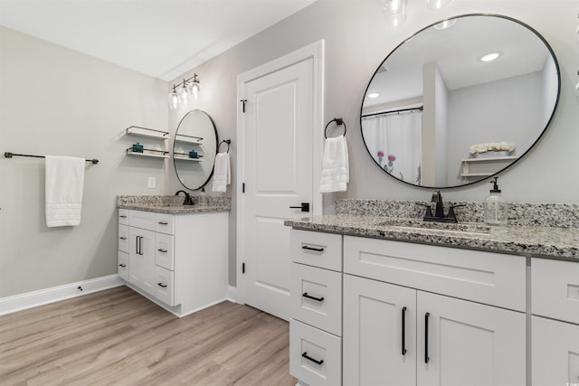 bathroom featuring vanity and wood-type flooring