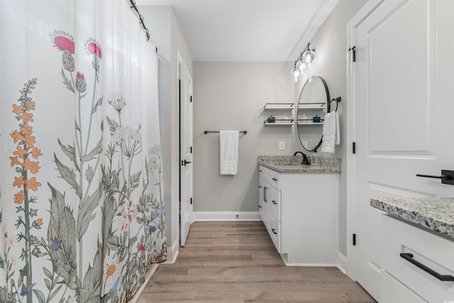 bathroom featuring hardwood / wood-style floors and vanity