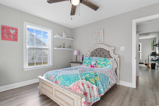 bedroom with hardwood / wood-style flooring and ceiling fan